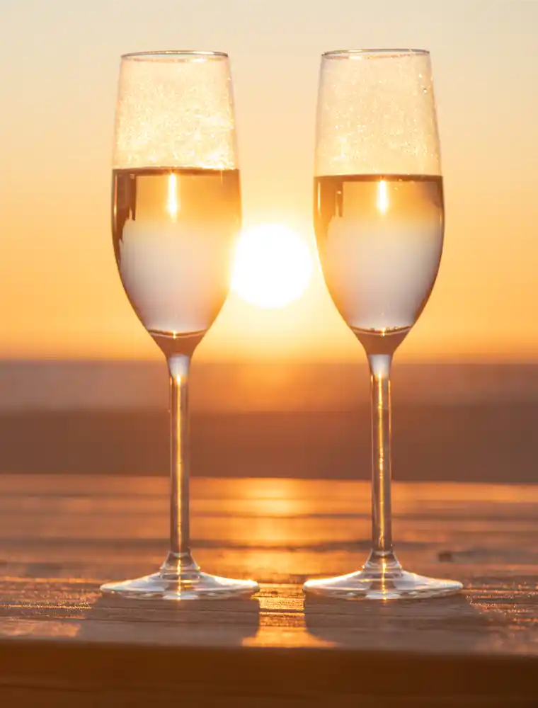 champagne glasses in sunset | Cancer Prevention Research Trust champagne glasses in sunset